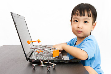 Image showing Chinese little girl using laptop