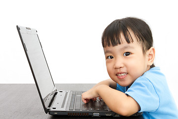 Image showing Chinese little girl using laptop