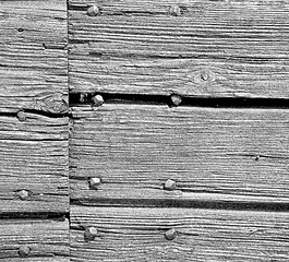 Image showing abstract texture of a brown antique wooden old door in italy   e