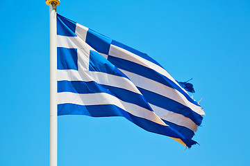 Image showing waving greece flag in the blue sky  flagpole