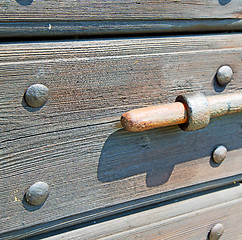 Image showing europe old in  italy  antique close brown door and rusty lock  c