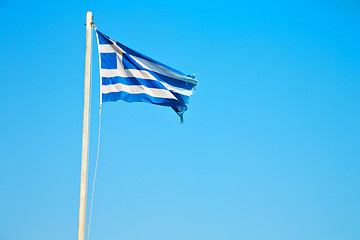 Image showing waving greece flag in the blue sky   flagpole