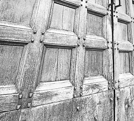 Image showing abstract texture of a brown antique wooden old door in italy eur