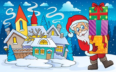 Image showing Santa Claus with gifts in winter scenery