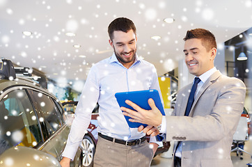 Image showing happy man with car dealer in auto show or salon