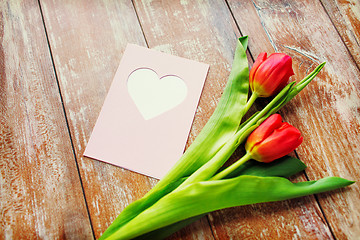 Image showing close up of tulips and greeting card with heart