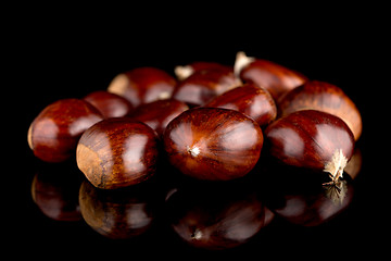 Image showing Chestnuts on a black reflective background