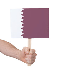 Image showing Hand holding small card - Flag of Qatar