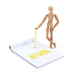 Image showing Wooden mannequin writing - Network
