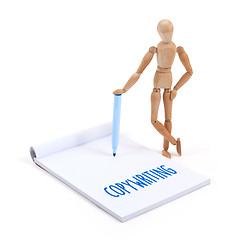 Image showing Wooden mannequin writing - Copywriting
