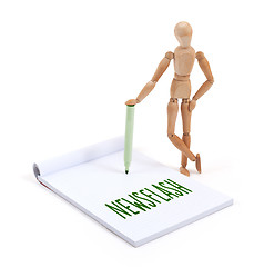 Image showing Wooden mannequin writing - Newsflash
