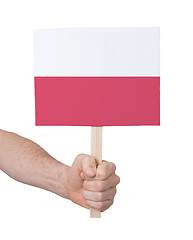 Image showing Hand holding small card - Flag of Poland