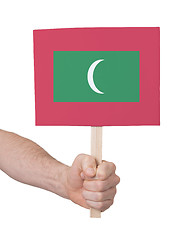 Image showing Hand holding small card - Flag of Maldives