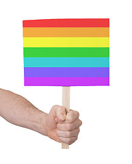 Image showing Hand holding small card - Flag of Rainbow flag