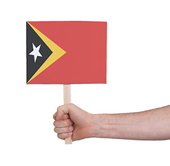 Image showing Hand holding small card - Flag of East Timor