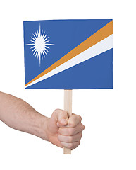 Image showing Hand holding small card - Flag of Marshall Islands