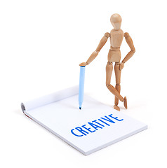 Image showing Wooden mannequin writing - Creative