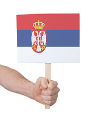 Image showing Hand holding small card - Flag of Serbia