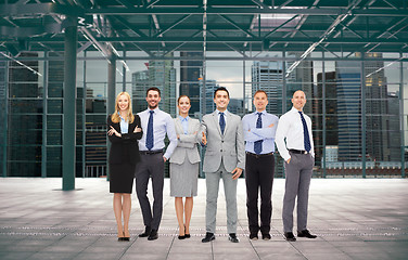 Image showing group of smiling businesspeople over office room