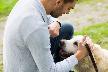 Image showing close up of man with labrador dog outdoors