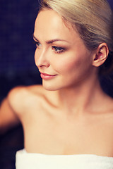 Image showing close up of young woman sitting in bath towel