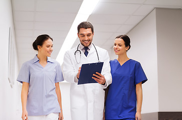 Image showing group of medics at hospital with clipboard