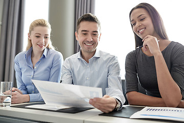 Image showing group of smiling businesspeople meeting in office