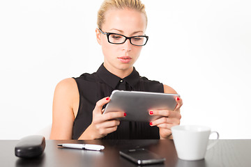 Image showing Business woman working on tablet PC.