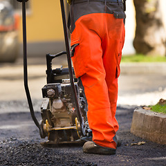 Image showing Asphalt surfacing manual labor.