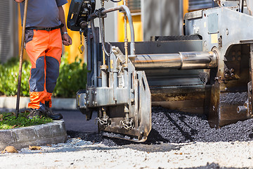 Image showing Asphalt surfacing manual labor.