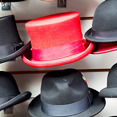 Image showing in london old red hat and black  the  fashion shop