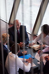 Image showing business people group on meeting at modern bright office