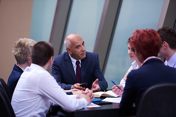 Image showing business people group on meeting at modern bright office