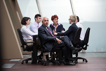 Image showing business people group on meeting at modern bright office