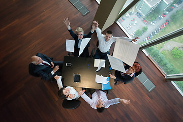 Image showing top view of business people group throwing dociments in air