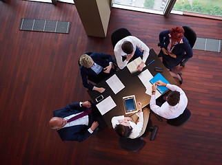 Image showing top view of business people group throwing dociments in air