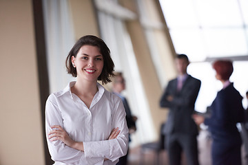 Image showing business people group, woman in front  as team leader