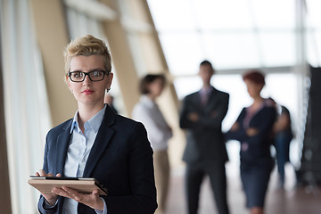 Image showing business woman  at office with tablet  in front  as team leader