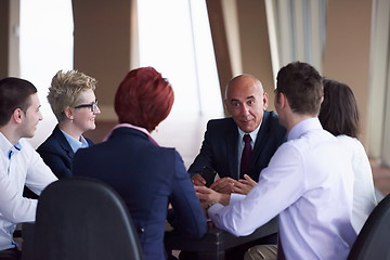 Image showing business people group on meeting at modern bright office