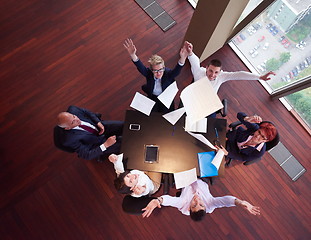 Image showing top view of business people group throwing dociments in air