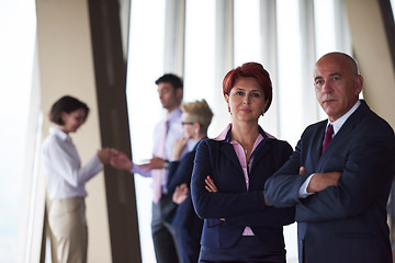 Image showing diverse business people group with redhair  woman in front