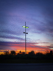 Image showing Modern streetlamp at sunset