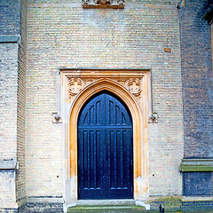 Image showing brown wooden parliament in london old  door and marble antique  