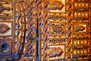 Image showing grey metal rusty      morocco in africa the old wood  padlock 