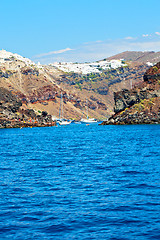 Image showing from one    santorini island house and rocks the sky