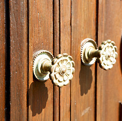 Image showing stripped paint  door    in italy   ancian wood and traditional  