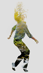 Image showing double exposure of nature and  young woman dancing