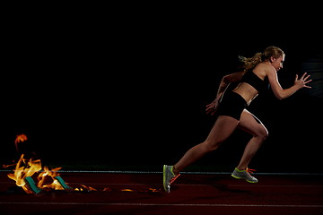 Image showing pixelated design of woman  sprinter leaving starting blocks