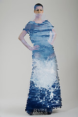 Image showing double exposure of elegant woman in fashionable dress posing in 