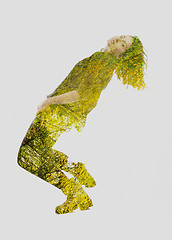 Image showing double exposure of nature and  young woman dancing